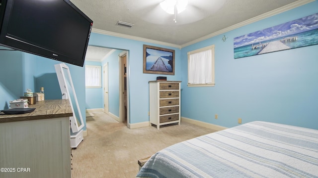 bedroom with ceiling fan, crown molding, and a textured ceiling