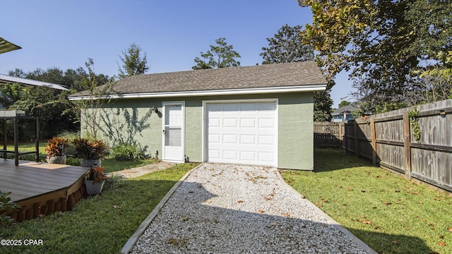 garage with a lawn