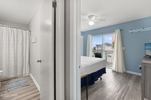 bathroom featuring hardwood / wood-style flooring, a textured ceiling, and ceiling fan