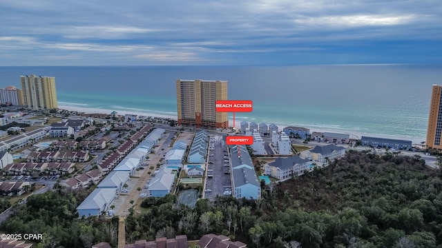 birds eye view of property featuring a water view and a view of the beach