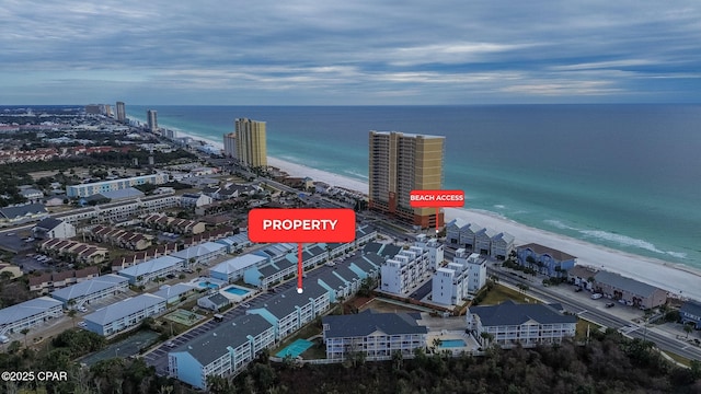 bird's eye view with a water view and a view of the beach