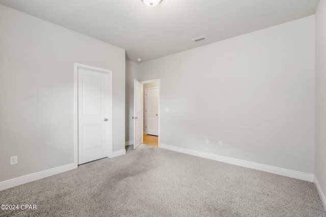 spare room with light colored carpet