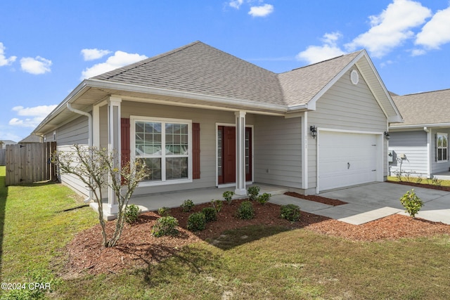 ranch-style house featuring a garage and a front yard