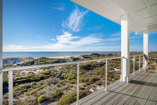 wooden deck featuring a water view