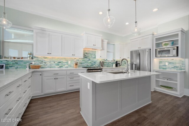 kitchen with dark wood-style floors, appliances with stainless steel finishes, light countertops, white cabinetry, and open shelves