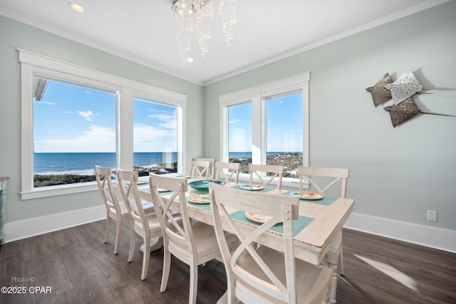 121 Gulf Hibiscus Dr, Port St Joe, FL 32456 - dining space with dark wood finished floors, an inviting chandelier, and a wealth of natural light