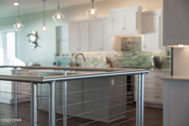 kitchen featuring white cabinetry and decorative light fixtures