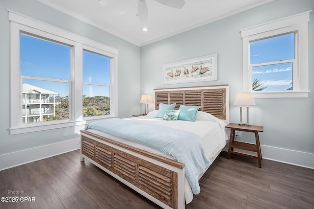 bedroom with ceiling fan and dark hardwood / wood-style floors