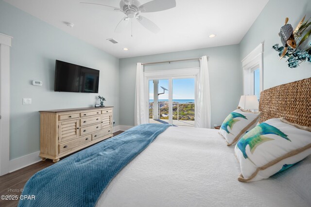 bedroom with ceiling fan, access to exterior, and dark wood-type flooring