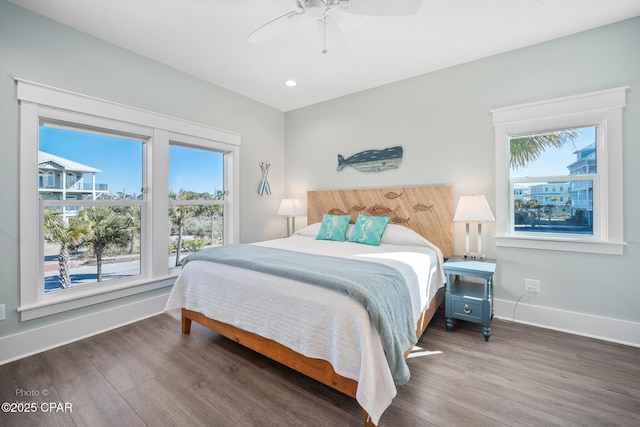 bedroom featuring ceiling fan and dark wood-type flooring