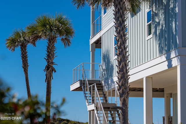 view of side of home with stairway