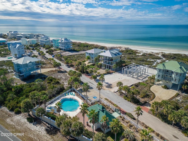 drone / aerial view featuring a water view and a beach view