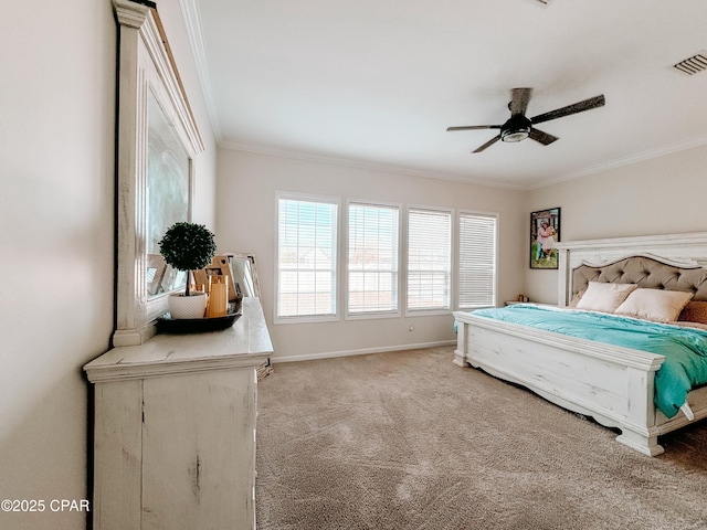 bedroom with carpet floors, ornamental molding, and ceiling fan