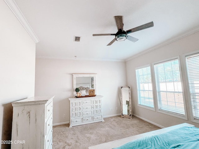 carpeted bedroom with crown molding and ceiling fan