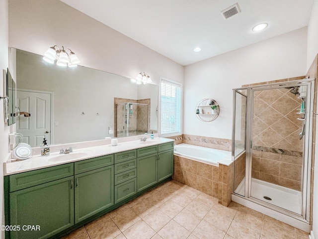 bathroom featuring tile patterned floors, vanity, and plus walk in shower