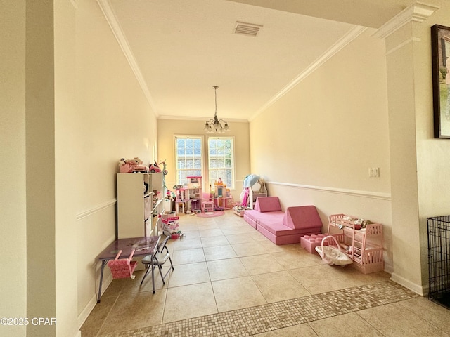 game room featuring crown molding, tile patterned floors, and a chandelier