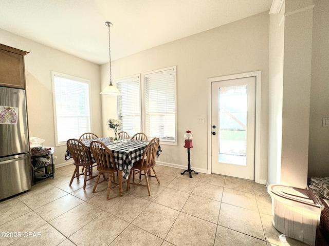 dining area with light tile patterned floors