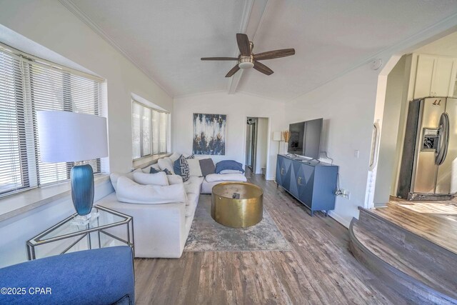 living room featuring vaulted ceiling, ceiling fan, and hardwood / wood-style floors