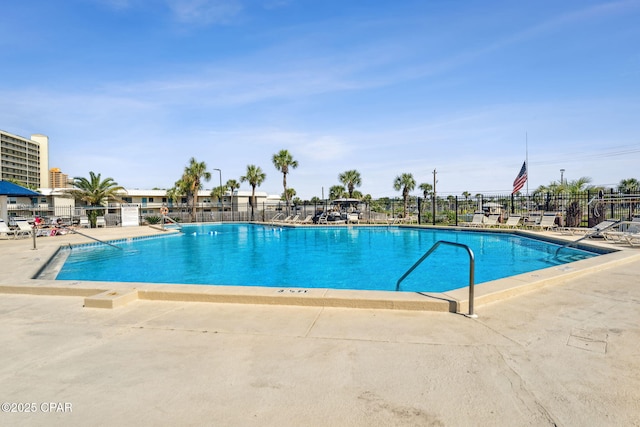 view of swimming pool with a patio