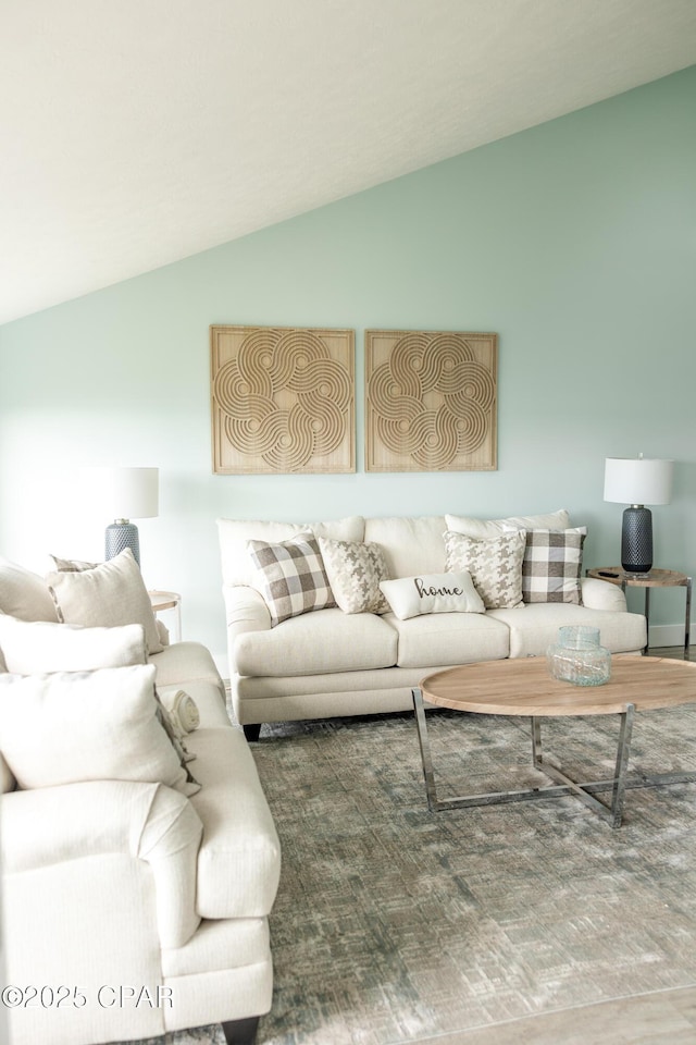 living area featuring vaulted ceiling