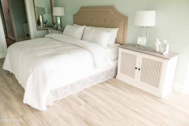 bedroom featuring wood finished floors