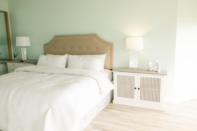 bedroom featuring wood finished floors