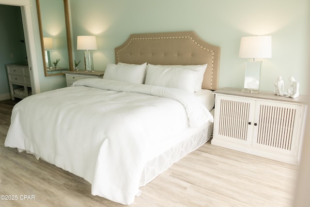 bedroom featuring wood finished floors