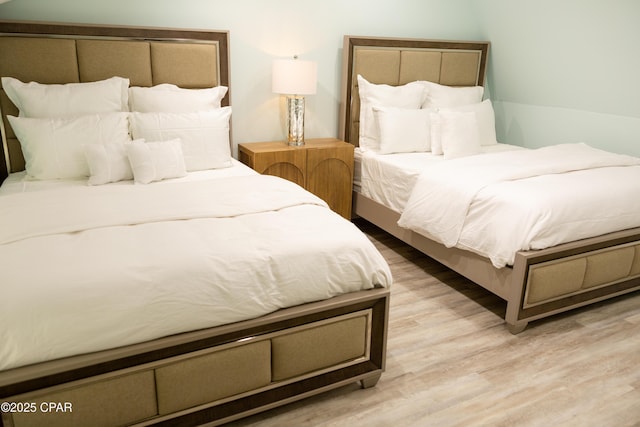 bedroom with wood finished floors