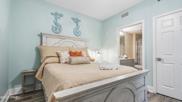 bedroom with dark wood-type flooring