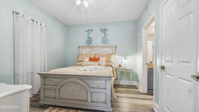 bedroom with ceiling fan and hardwood / wood-style floors