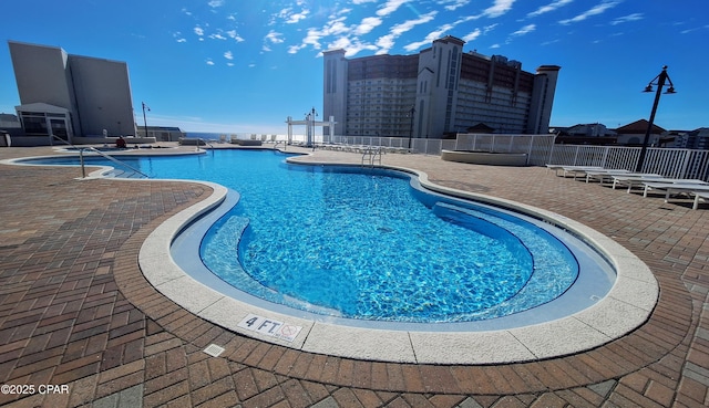 view of swimming pool with a patio area