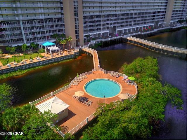 view of swimming pool featuring a water view and a gazebo