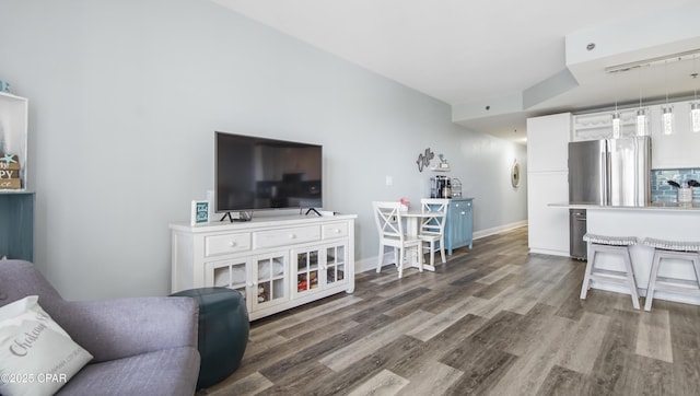 living room with dark hardwood / wood-style flooring