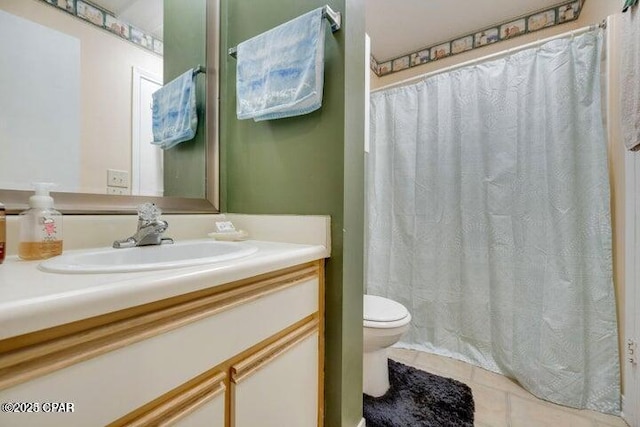 bathroom with tile patterned flooring, a shower with shower curtain, vanity, and toilet