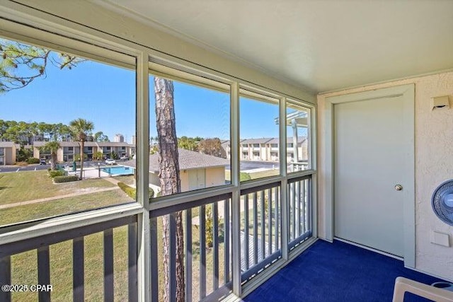 unfurnished sunroom with a residential view