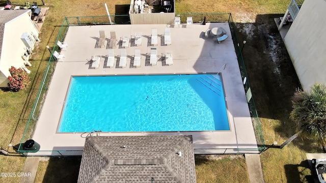 view of pool featuring fence