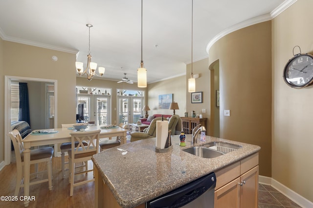 kitchen with stainless steel dishwasher, sink, a kitchen island with sink, french doors, and ceiling fan with notable chandelier