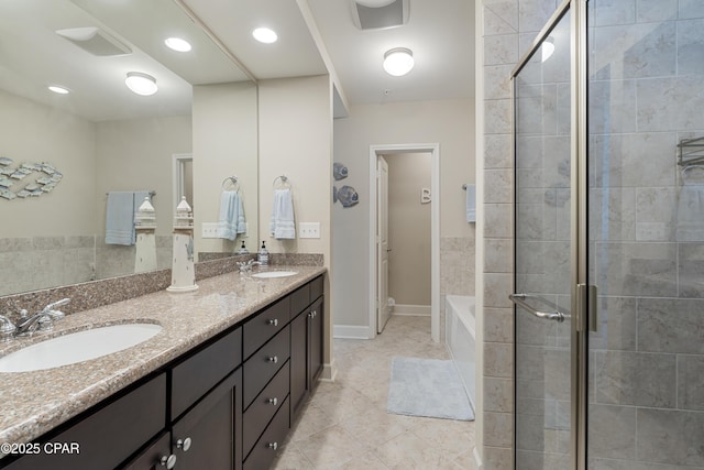 bathroom featuring tile patterned floors, vanity, and independent shower and bath