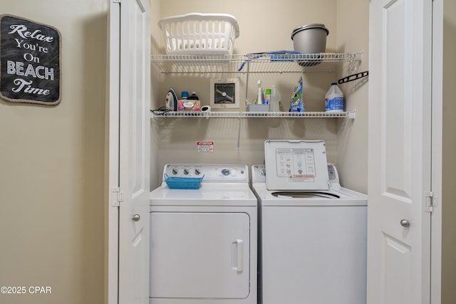 laundry area with independent washer and dryer