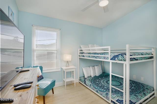 bedroom with ceiling fan and hardwood / wood-style flooring