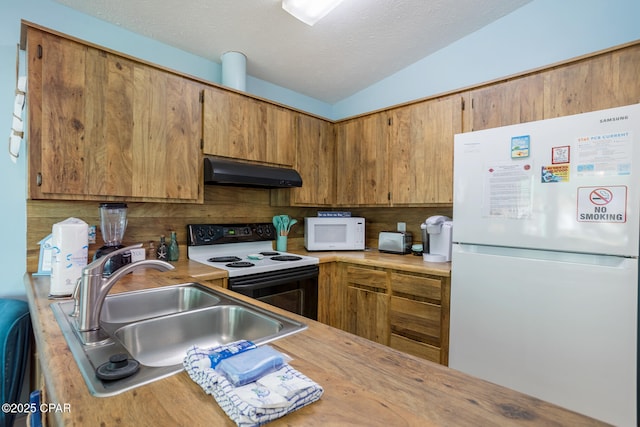 kitchen featuring decorative backsplash, white appliances, a textured ceiling, vaulted ceiling, and sink