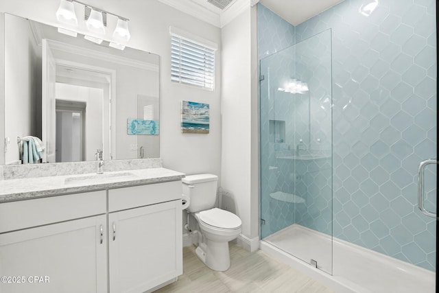 bathroom featuring a shower stall, vanity, baseboards, toilet, and ornamental molding