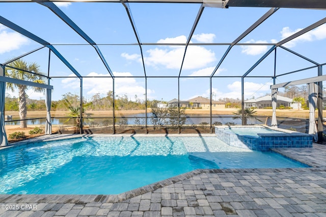 view of swimming pool with a water view, an in ground hot tub, a patio area, and glass enclosure