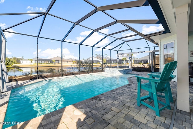 view of pool featuring glass enclosure, a residential view, a water view, a pool with connected hot tub, and a patio