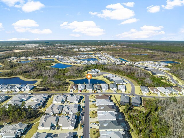 bird's eye view featuring a water view and a residential view