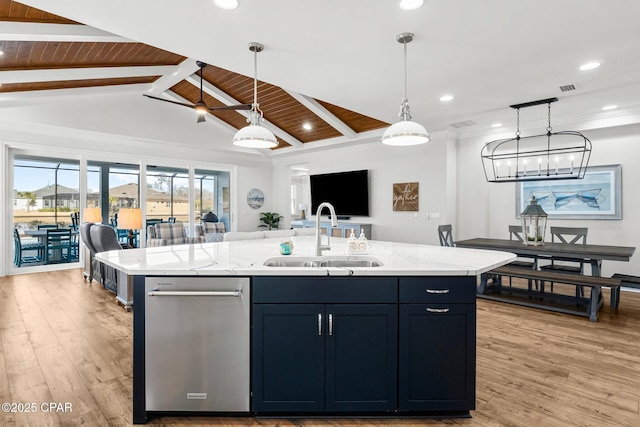 kitchen with a sink, decorative light fixtures, light wood-type flooring, wood ceiling, and open floor plan