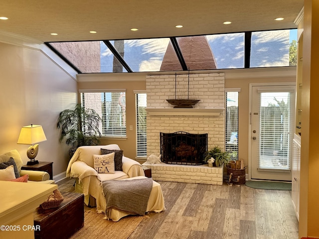 interior space with crown molding, a fireplace, and hardwood / wood-style floors