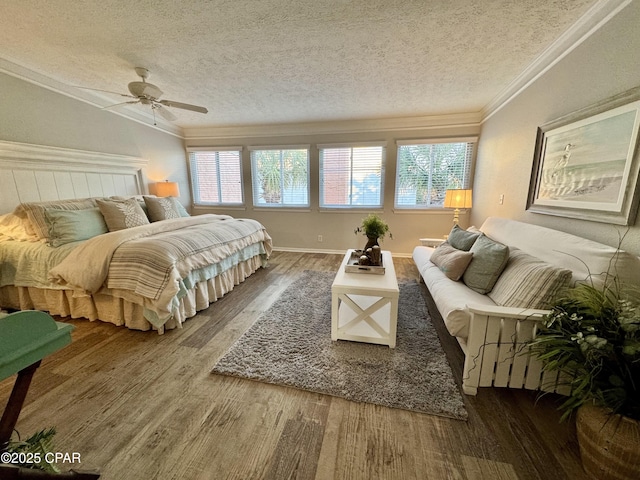 bedroom featuring ceiling fan, ornamental molding, hardwood / wood-style floors, and a textured ceiling