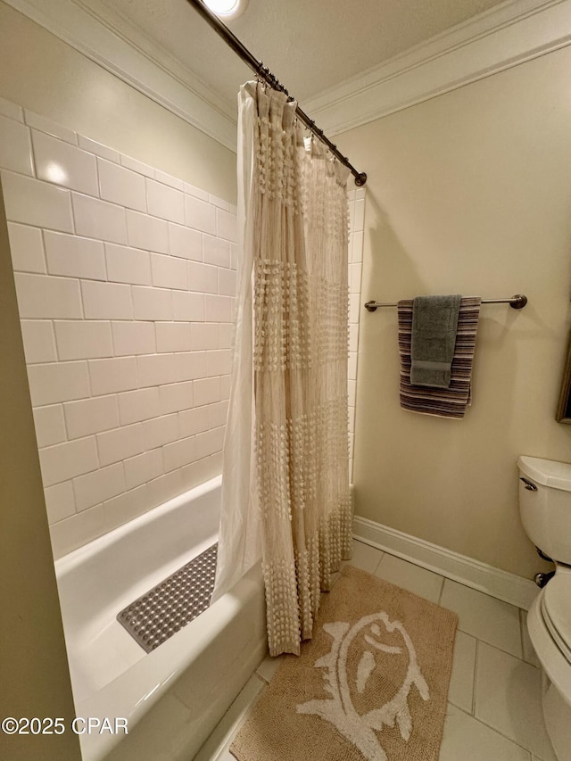 bathroom with tile patterned flooring, ornamental molding, shower / tub combo, and toilet