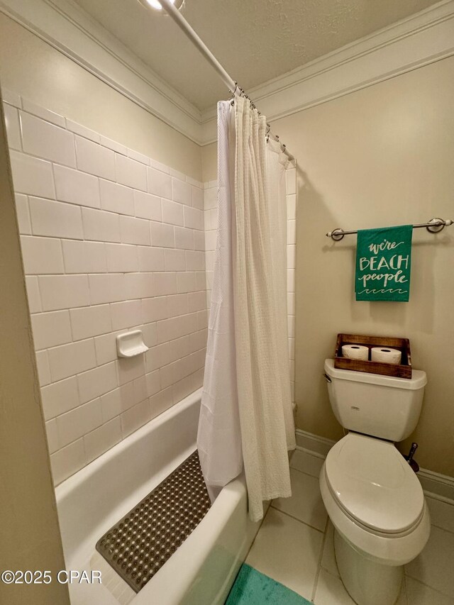 bathroom with crown molding, toilet, tile patterned flooring, and shower / tub combo